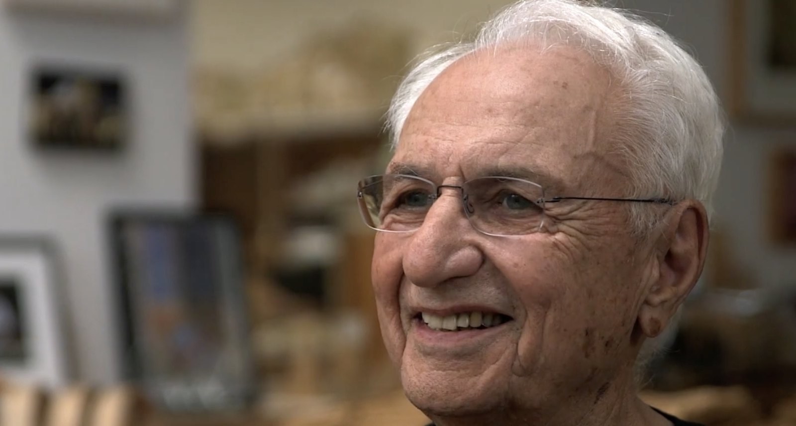 Frank Gehry smiling in his studio during his Briefly interview.