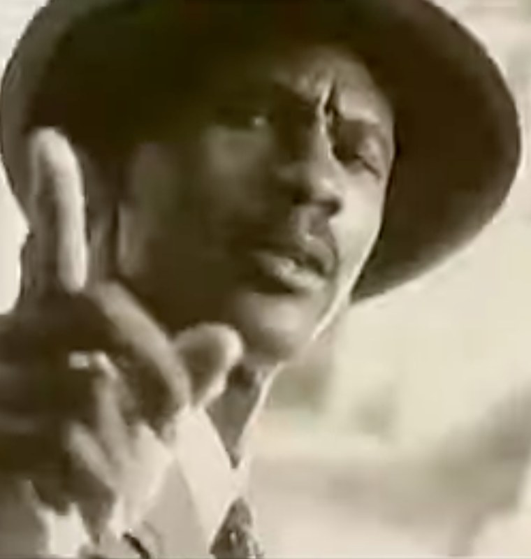 Michael Jordan in a hat and suit, from the CEO Jordan TV spot.